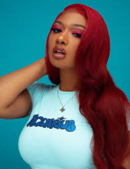 Megan Stallion in a red hair.